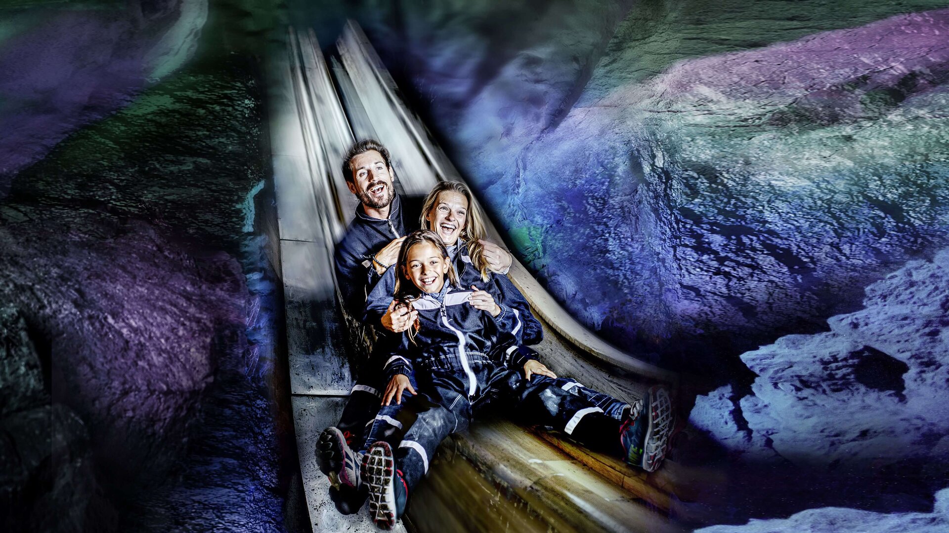 Happy family on the slide