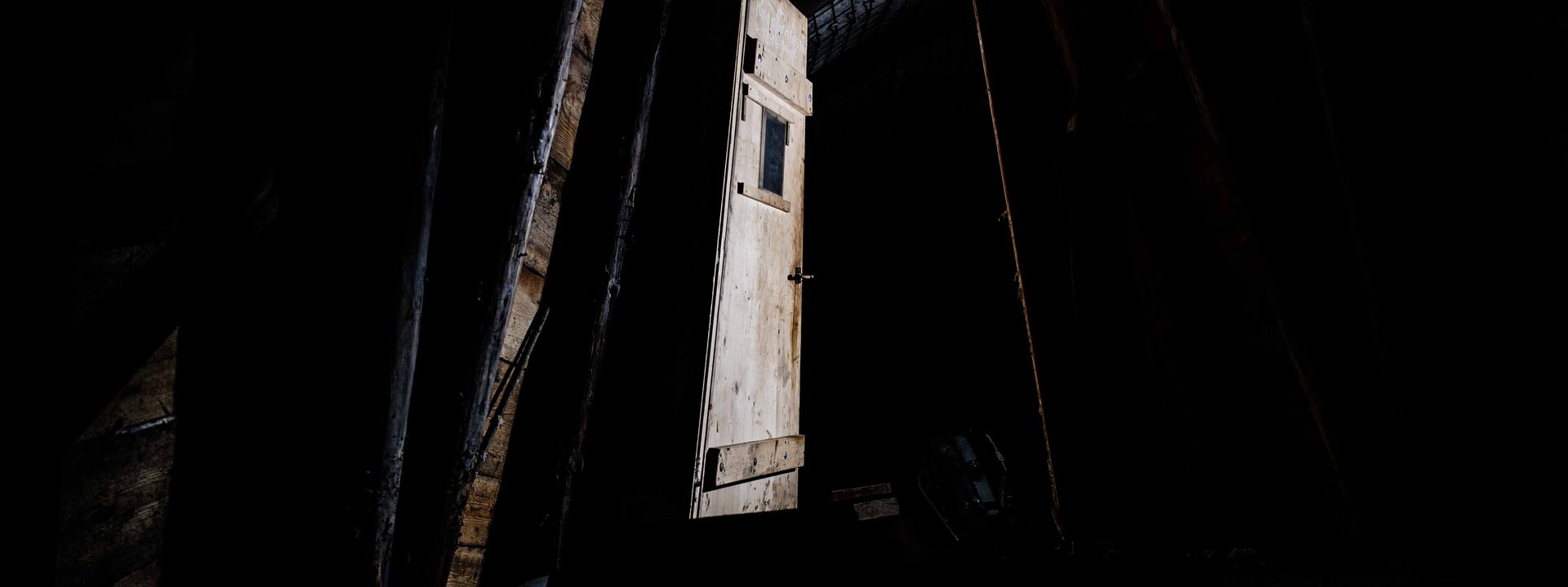 Dark door in the underground tunnel