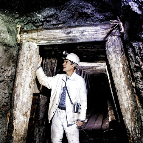 Miner in the tunnel underground