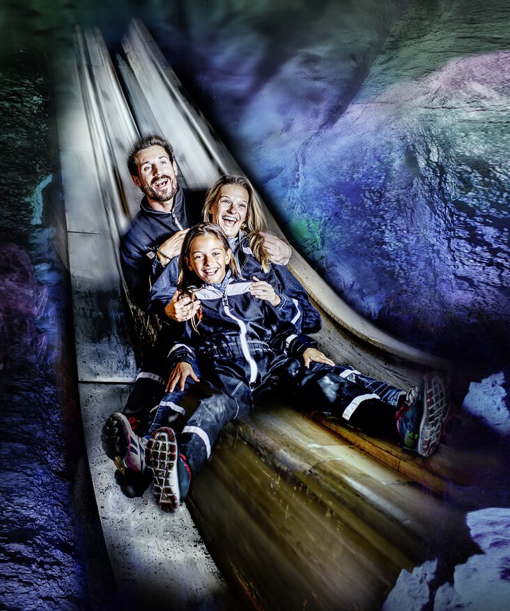 Happy family on the slide