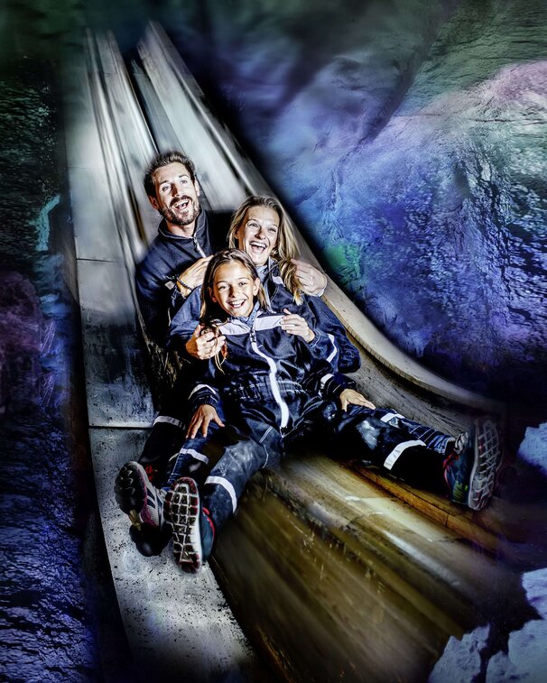 Happy family on the slide