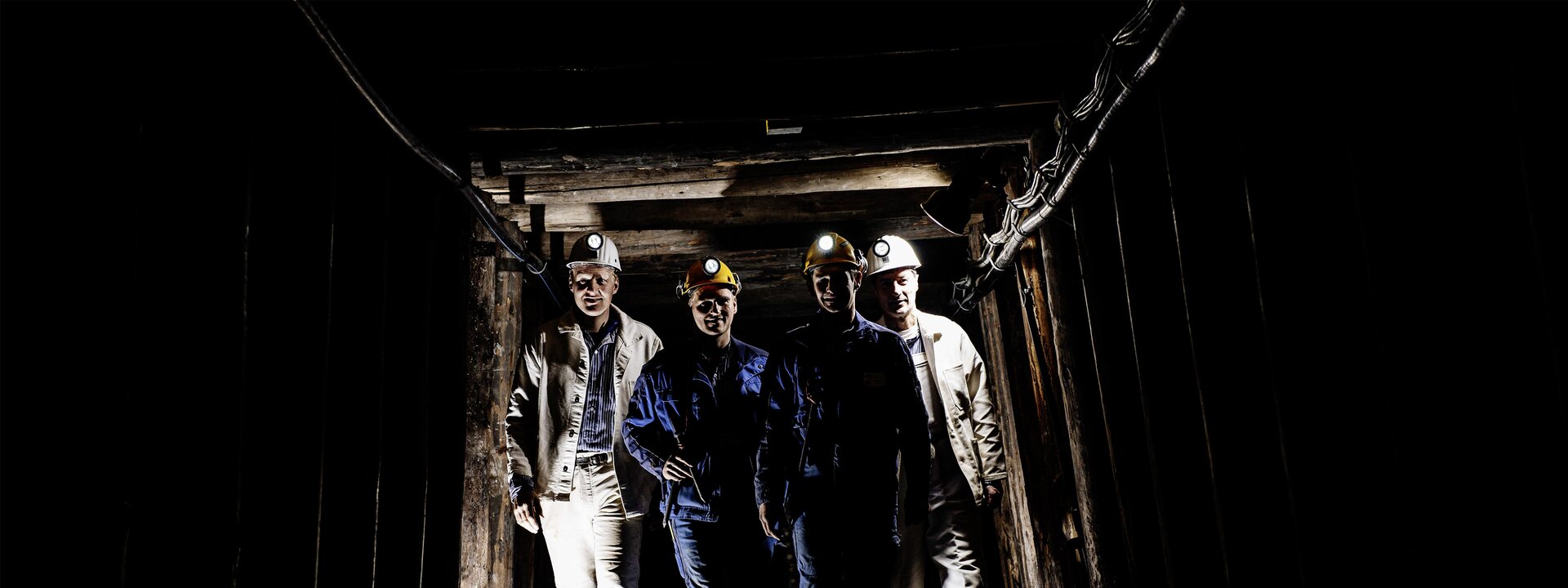 Four miners in the underground tunnel